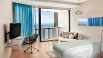 King Hilton Deluxe Seaview - Be totally at home in this truly contemporary 46sqm room offering LCD TV, rain shower with unobstructed ocean views from your private balcony.